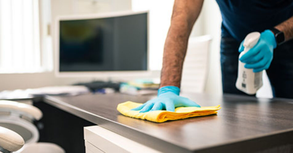 office-cleaning_thumb-1200x627 - Prime Cleaning Services cleaning an office desk